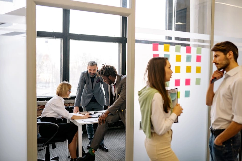 The diverse team of Wellspring Life collaborating in a bright, modern office.